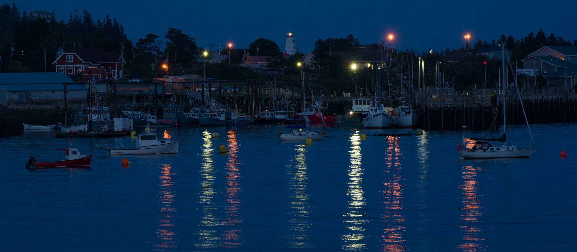 Swallowtail Lighthouse Over North Head Wharf at Twilight